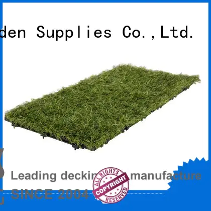 high-quality interlocking deck tiles on grass artificial grass path building